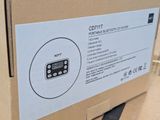 a box with a remote control on it sitting on a table