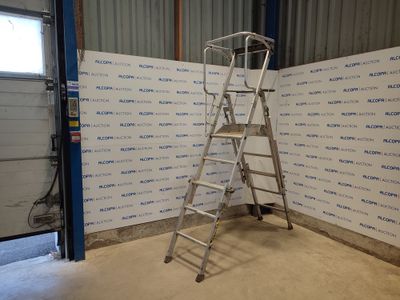 a ladder that is standing in front of a wall