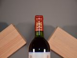 a bottle of wine that is sitting on a table