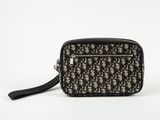 a black and white cross body bag on a white background