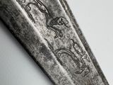 a knife that has been carved into the side of a wall