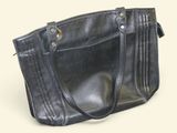 a black purse that is sitting on a table