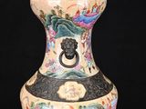 a vase with a handle on it on a black background
