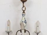 a small chandelier with three lights attached to it