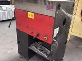 a machine that is sitting inside of a building