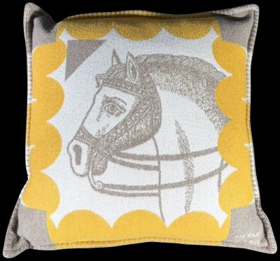 yellow and grey horse pillow with yellow dots on it