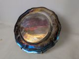 a silver plate with a blue and red design on it