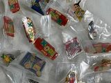 a pile of small plastic toys that are on a table