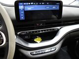 a car dashboard with a touch screen and a steering wheel