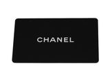 chanel logo on black plastic card with white lettering