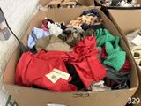 a cardboard box filled with clothes and other items