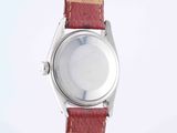an image of a close up of a wrist watch on a white surface