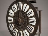 a clock with roman numerals on the face of it