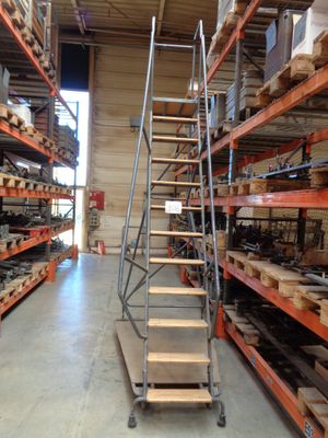 a ladder that is sitting in the middle of a room