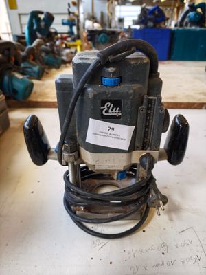 a picture of a drill on a table in a workshop