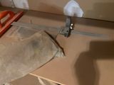 a piece of paper on a table with a ruler on it