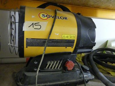 a yellow and black blow dryer sitting on the floor