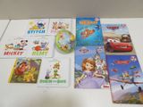 many children ' s books and dvds on the table