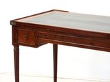 a small wooden table with a glass top on it