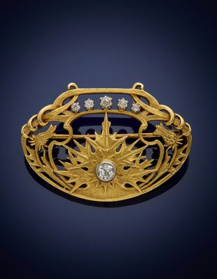 a gold and diamond broochle, by van cleef