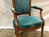 an image of a chair with a blue upholstered upholstered seat