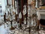 a table with a bunch of crystal candles on it