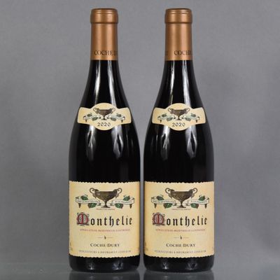 two bottles of wine sitting next to each other on a table