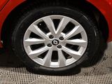 a close up of a red car tire on the floor