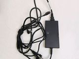a black charger with a cord attached to it