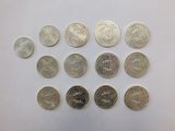 many different types of coins on the table
