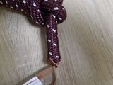 a rope with a knot on it on a wooden floor
