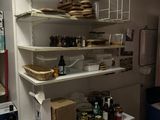 a shelf that has some food on it in a room