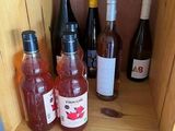 many bottles of wine sitting on a shelf next to each other