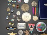 a lot of medals and medals on a table