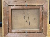 an old picture of a picture frame sitting on a wooden floor