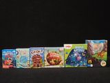 a lot of children ' s board games on the table