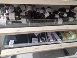 a display case filled with hair brushes and other hair products