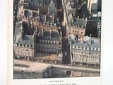 une vue aérienne d'une ville avec des immeubles et une tour horloge