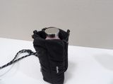 a bottle holder with a bottle in it sitting on a table