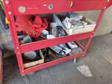 a red work bench with a lot of tools on it