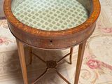 a small table with a glass top on a rug