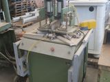 a machine that is sitting in a warehouse with other machines