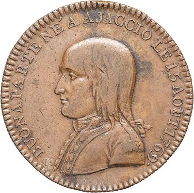 a close up of a coin with a man ' s face on it
