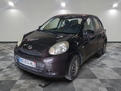 a picture of a small black car parked in a garage