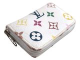 a close up of a white wallet with multicolored designs on it