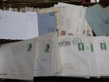 an open suitcase filled with lots of mail sitting on top of a table