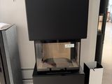 a fish tank sitting on top of a black cabinet