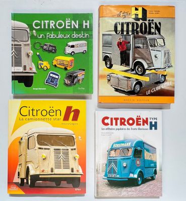 quatre livres pour enfants sont alignés sur une surface blanche