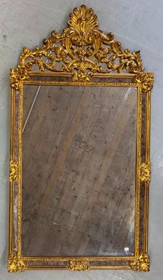 a mirror hanging on the wall in a room