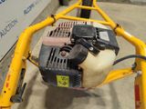 a small machine that is sitting on the ground